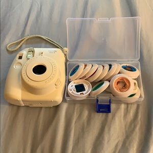 Fujifilm Polaroid camera and colorful lens caps